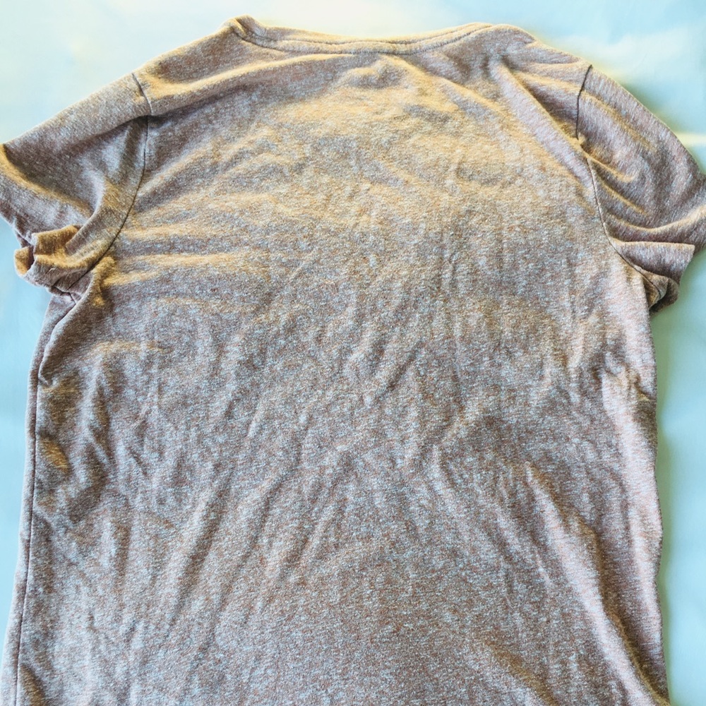 Reddish orange shirt with front pocket